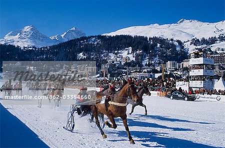 A trotting race with jockeys driving horse-drawn sleighs on the frozen lake at St Moritz