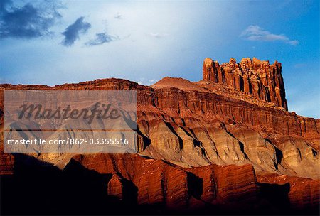 Tall cliffs,layered in different coloured clays and stone,typify the landscape of Capitol Reef