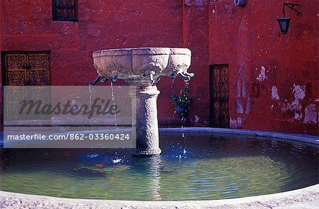A fountain drips quietly in one of the tranquil squares.