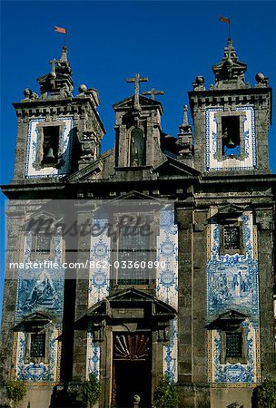 Azulegos,or glazed and painted tiles - almost always blue and white - enliven an otherwise plain church facade.