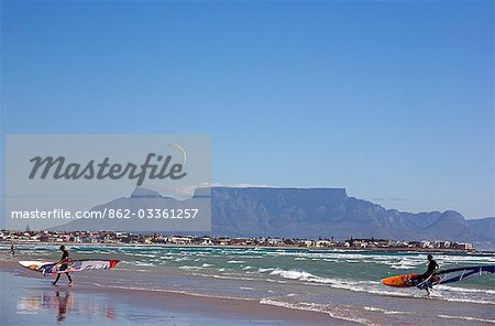 South Africa,Western Cape,Cape Town. Looking across Table Bay to Table Mountian from Bloubergstrand on a Sunday with walkers and outdoor enthusiasts enjoying the fine weather.
