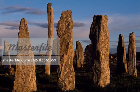 Sunset over the central circle of standing stones at Callanish. An ancient stone circle dating back to Neolithic times,Callanish is the most dramatic prehistoric site in the Hebrides and is sometimes referred to as the Stonehenge of Scotland