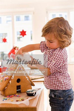 Young boy baking cake house
