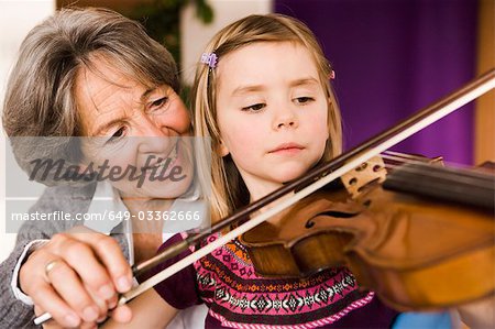 grandma teaching grandchild music