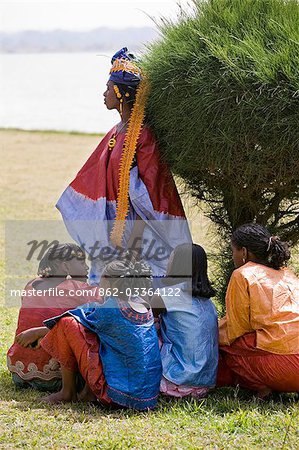 Mali,Bamako. A group of smartly-dressed Malian women in brightly-coloured starched traditional cotton outfits at Bamako.