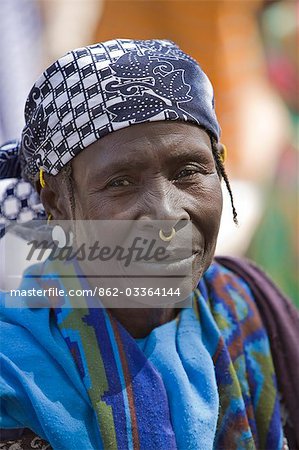 Mali,Djenne. A Peul woman wearing a gold nose ornament at Djenne market. The weekly Monday market is thronged by thousands of people and is one of the most colourful in West Africa.