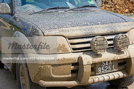 Mud splattered four wheel drive after driving local road during the wet season,Sepilok,Sabah,Borneo
