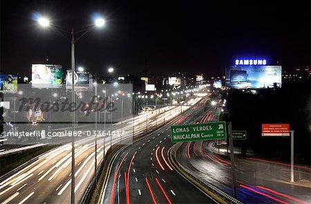 Mexico,Mexico City. The Boulevard Periferico at The Torres de Satalite (Satelite Towers),urban sculptures located in Ciudad Satalite (Satellite City),a middle class zone,in the northern part of Naucalpan,Mexico City.
