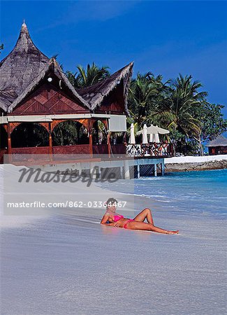 Woman relaxing on the beach,Maldive Islands. Indian Ocean .