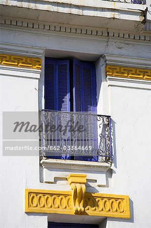 Blue shutters on the colonial facade of the Hotel Central in the old medina of Morocco
