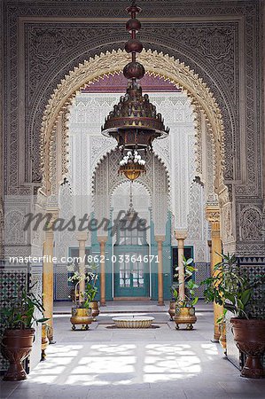 The interior of the Mahakma du Pasha in the Quartier Habous or New Medina in Casablanca. The building was once a palace and law courts but is now a police prefecture. It has over 60 rooms decorated with carved wooden ceilings,stuccos and stone floors.