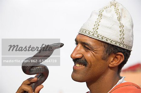 A snake charmer performs in the Djemaa el Fna,Marrakech.