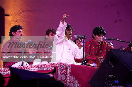 Morocco,Fes. Faiz Ali Faiz and his ensemble from Pakistan perform Qawwali using traditional portable harmoniums on the Bab Makina stage,during the Fes Festival of World Sacred Music.