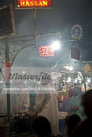 Morocco,Marrakech. The Djemaa El Fna is the main square of Marrakesh,used equally by locals and tourists. As dark descends the square fills with dozens of food-stalls,and the crowds are at their height.