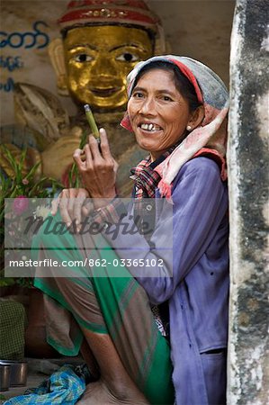 Myanmar. Burma. Bagan. A Burmese woman at the Tharaba Gate,the gates into the old city of Bagan which were built in 849 AD and renovated in the 11th century.