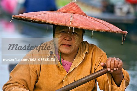 Myanmar. Burma. Lake Inle. A Burmese woman at the floating market of Ywa-ma on Lake Inle.