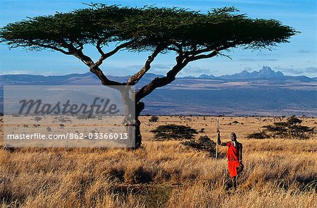 Kenya,Mount Kenya,Lewa Downs. Maasai warrior at Lewa Downs with Mount Kenya in background.
