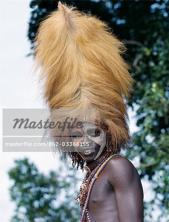 Kenya,Trans-Mara,Lolgorien. The Maasai do not eat game meat or birds. Consequently,the wildlife in their vast grazing areas has been left relatively undisturbed. The warriors do hunt lions,however,when their cattle are killed. The warrior who spears a lion to death will make a busby-style headdress from its mane.