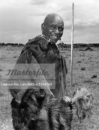 Kenya,Rift Valley Province,Kapsabet. A Nandi laibon,or soothsayer,wearing a traditional monkey skin cape.