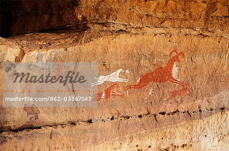 Rock painting depicting a hunting scene in the Jebel Acacus in the Libyan Sahara,Libya