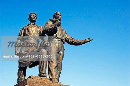 Lithuania,Vilnius. Soviet style statues on Zaliasis Titlas Bridge - part of Vilnius Unesco World Heritage Site.