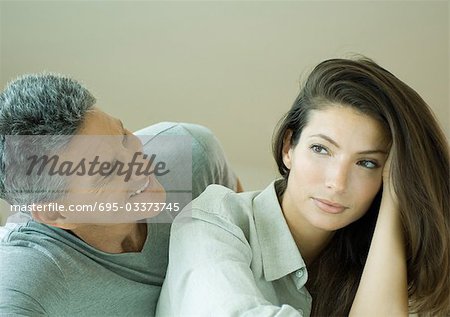 Couple, man looking at woman