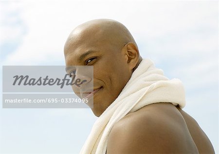 Man with towel around neck