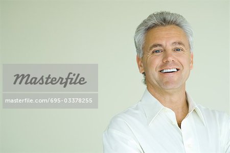 Mature man smiling, head and shoulders, portrait