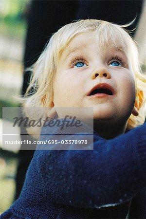 Little girl looking up, portrait