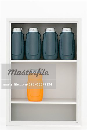Medicine cabinet containing orange and black bottles