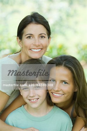 Portrait of mother with teenage daughter and son