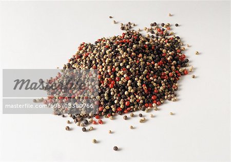 Pile of red, black and white peppercorns