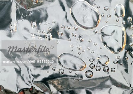 Drops on metallic surface, close-up