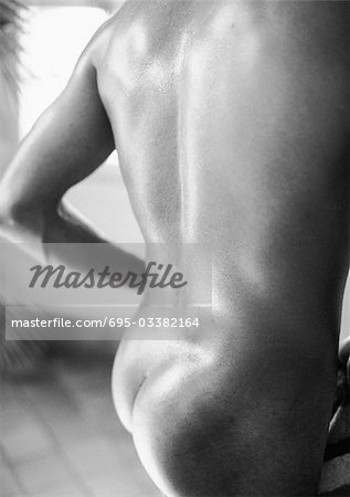 Man's bare back and buttocks, b&w