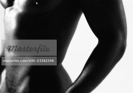 Man's bare torso, close up, black and white.