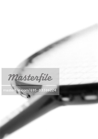 Badminton racket, blurred, close-up, b&w.