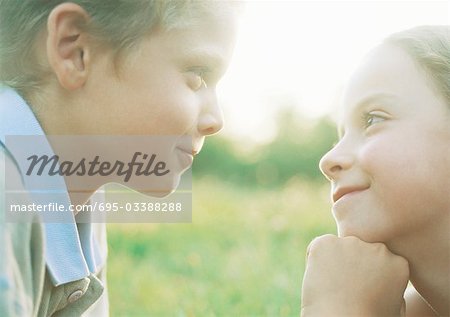Boy and girl gazing into each other's eyes