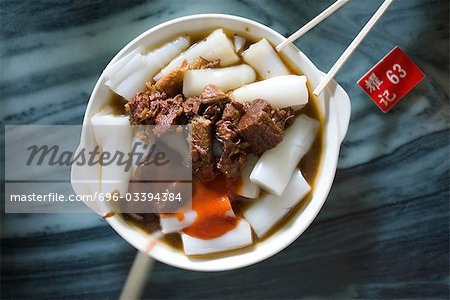 Chinese dish on table next to table marker