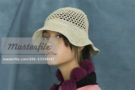 Teenage girl wearing sun hat, looking at camera, portrait