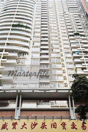 China, Guangdong Province, Guangzhou, facade of high rise apartment building