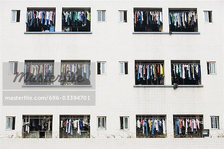 Laundry hanging to dry in balconies of apartment building