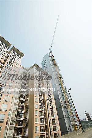 High rises, one under construction, low angle view