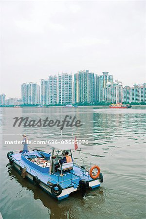 Garbage boat cleaning river