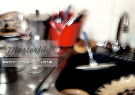 Dishes by sink, blurred.