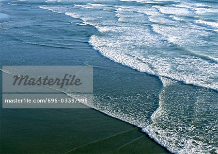 California, surf washing up on shore, close-up