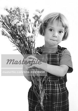 Little girl holding bouquet, b&w