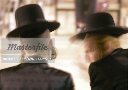 Israel, Jerusalem, two Orthodox Jews conversing, blurred motion