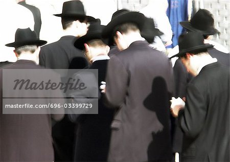 Israel, Jerusalem, Orhtodox Jewish men praying at the Wailing Wall