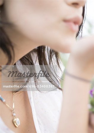 Woman blowing kiss, close-up