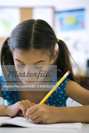 Female elementary school student in class